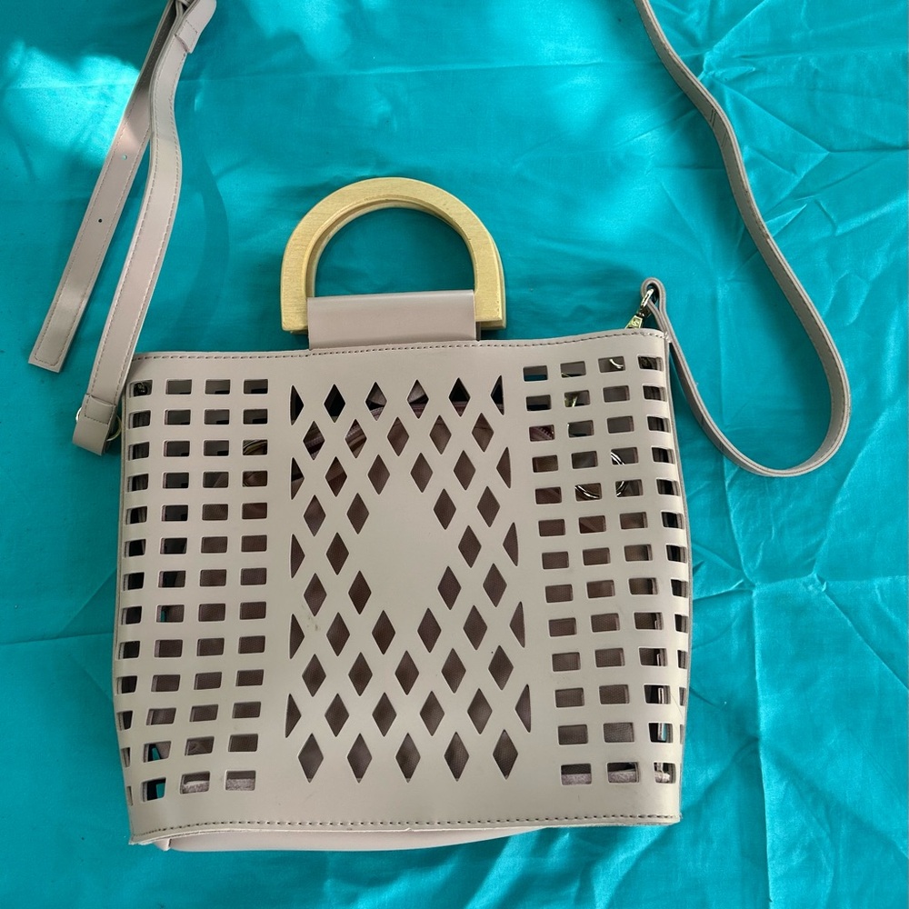 Joy Susan Taupe Laser-Cut Shoulder Bag with Gold Handle Accent. Dusty pink